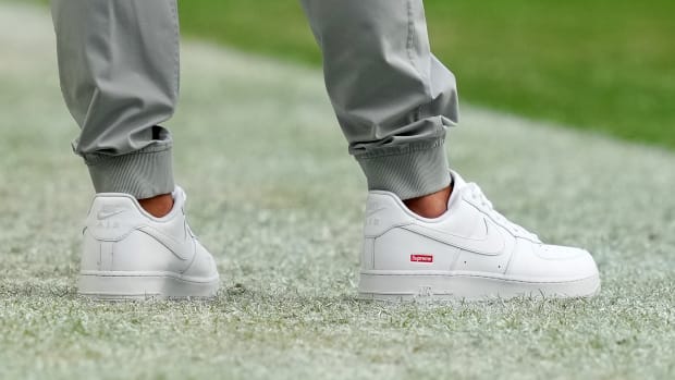 View of Coach Mike McDaniel's white shoes.